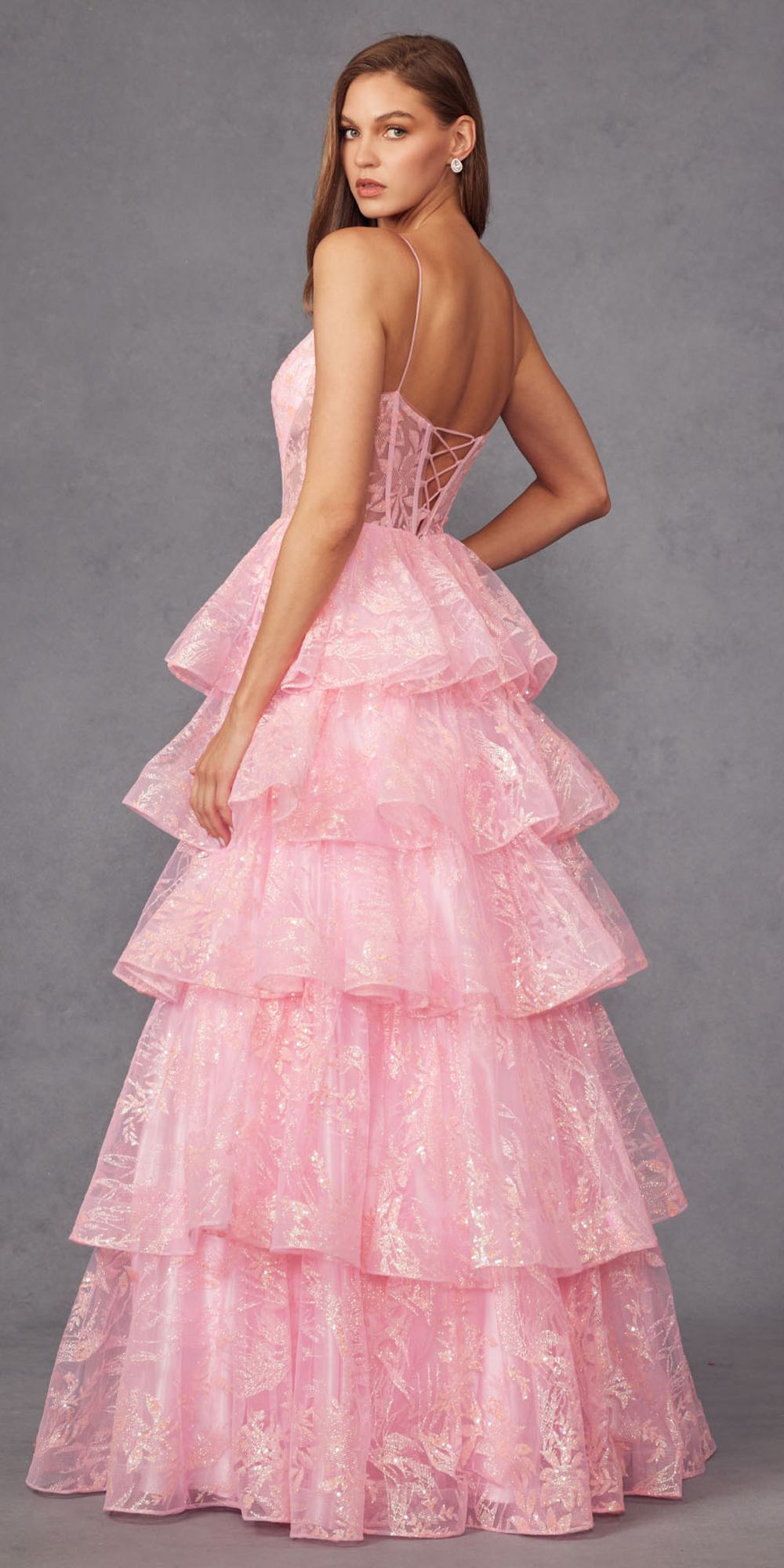 Candy pink glitter A-line gown with open crisscross back and tiered ruffle skirt