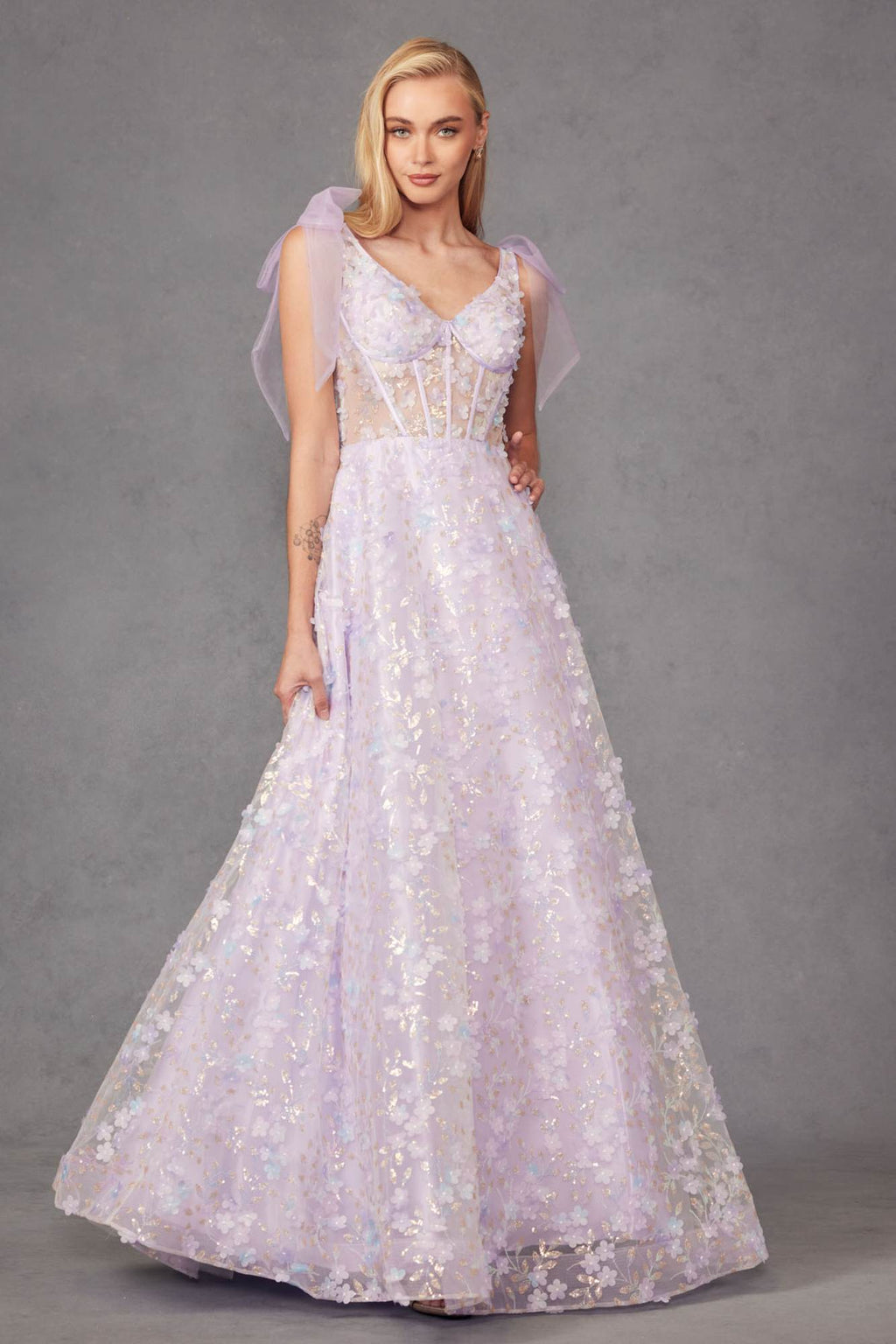 Lilac A-line long gown with V-neck, sleeveless embroidered bodice, 3D floral glitter skirt.