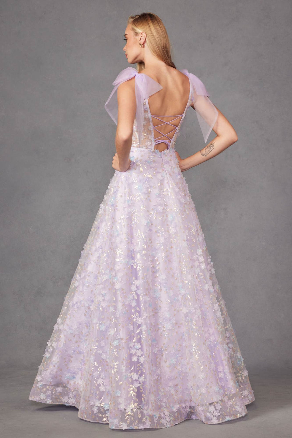 Lilac A-line gown back view with lace-up open back, 3D floral glitter print, tulle.