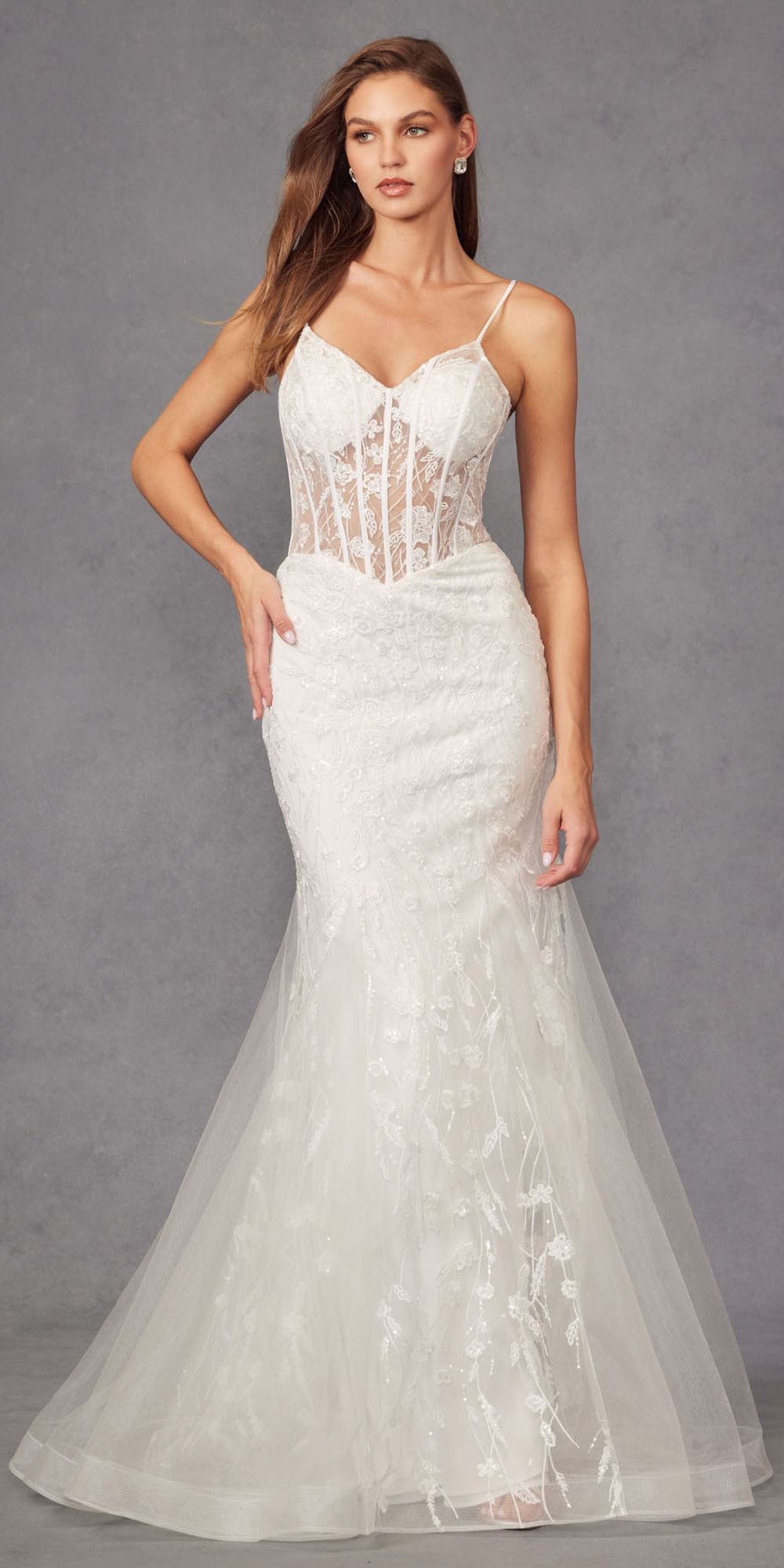 Off-white mermaid wedding dress with embellished corset bodice and layered tulle hem