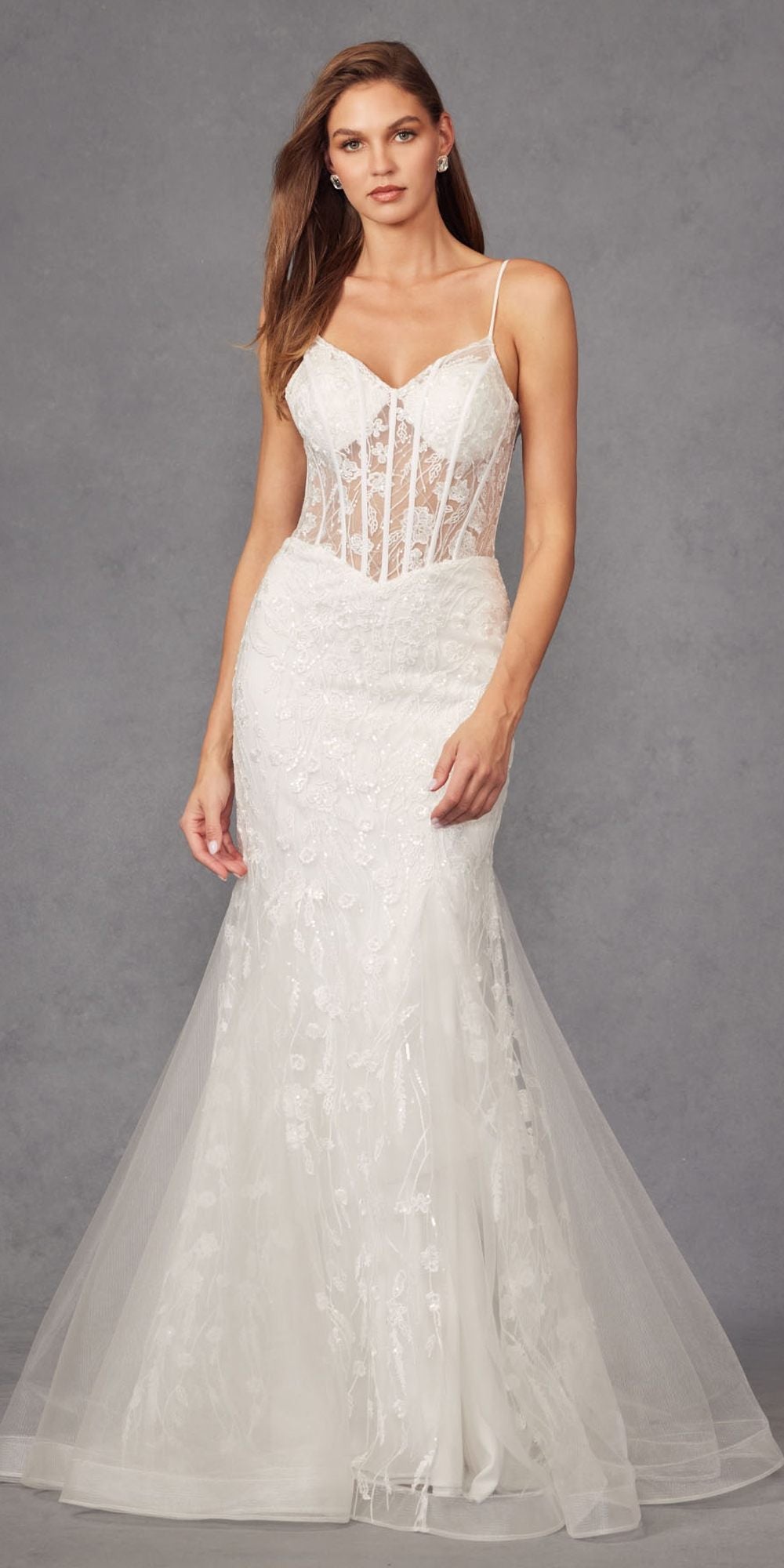 Off-white embellished mermaid wedding dress with structured corset bodice and tulle skirt