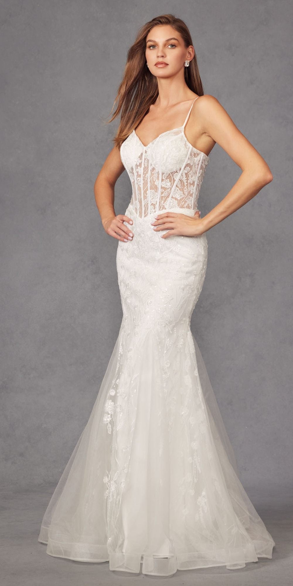 Off-white mermaid wedding dress with corset bodice embellishment and sheer tulle skirt