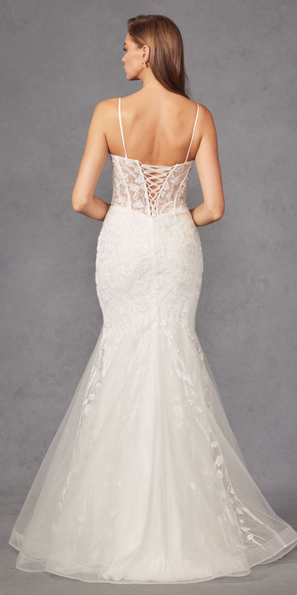 Off-white mermaid wedding dress with lace back bodice and flowing tulle train