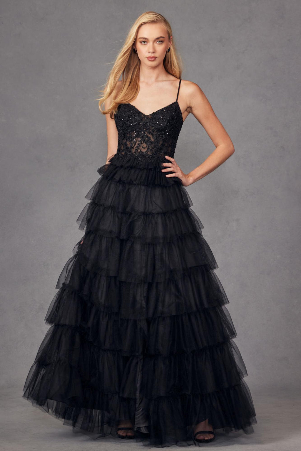 Black sleeveless lace bodice A-line gown with layered tiered ruffle skirt and thin straps