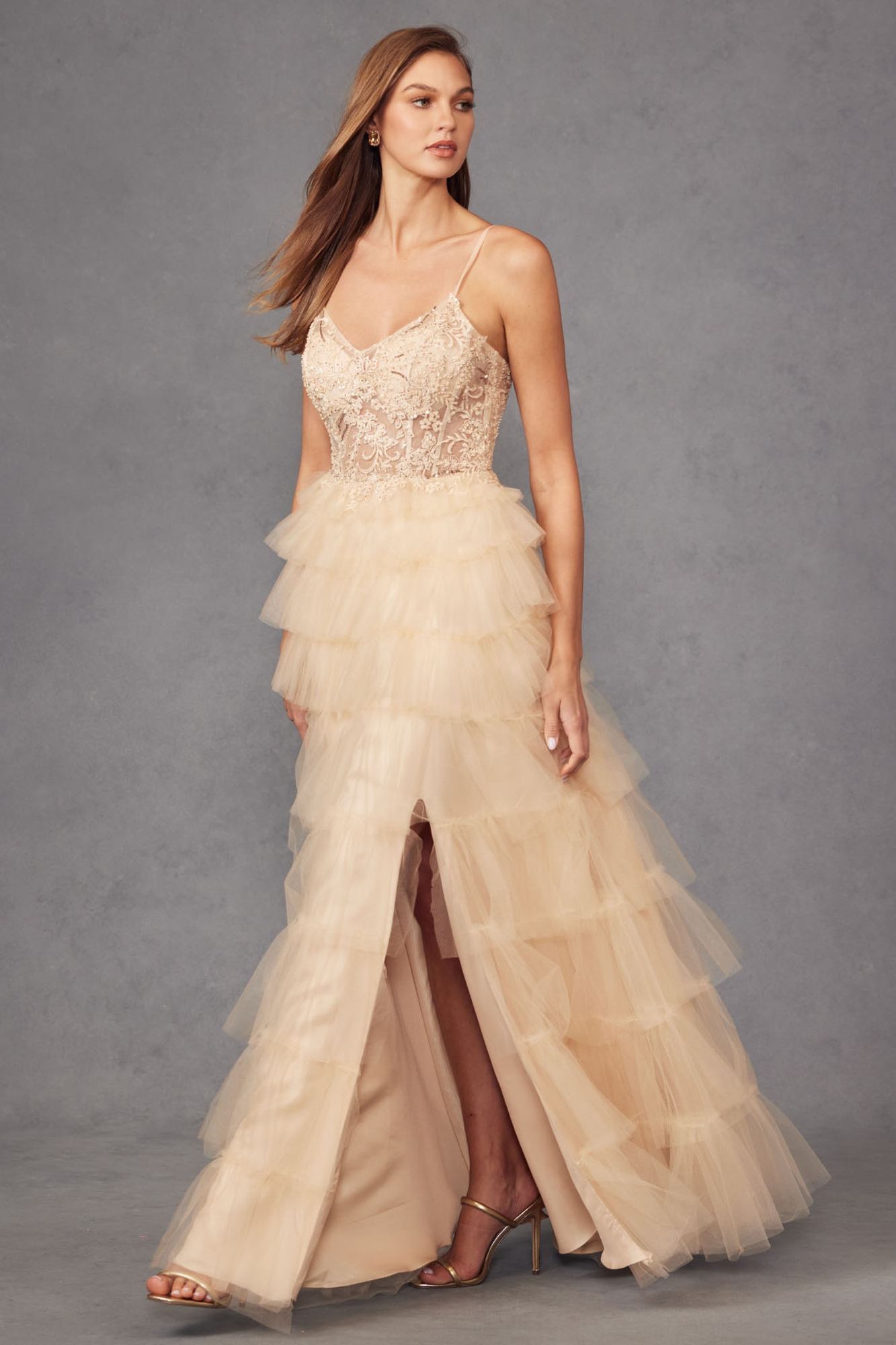 Ivory lace sleeveless bodice tiered tulle A-line ruffled gown with side slit