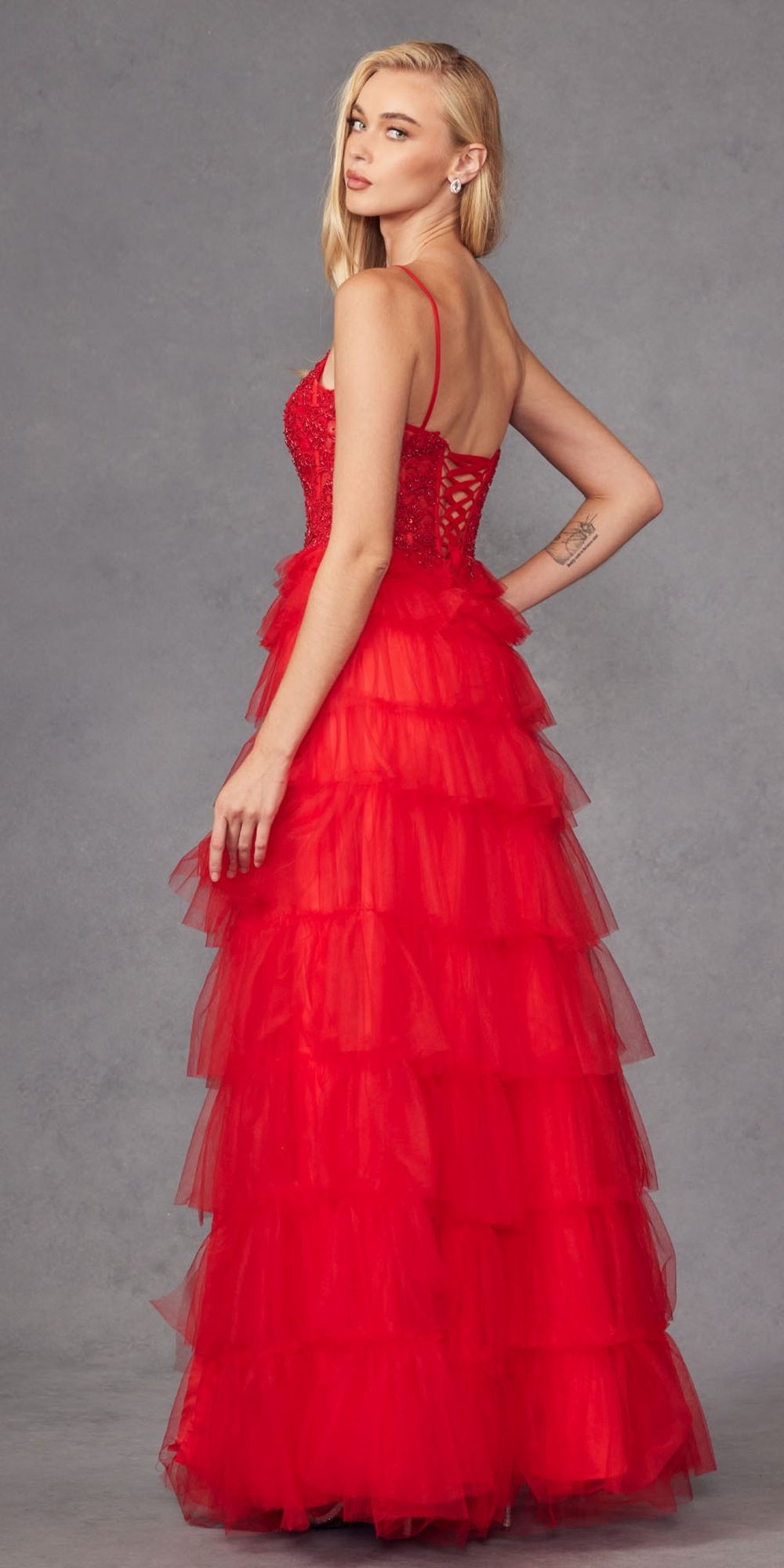 Red sleeveless lace bodice gown with tiered ruffle tulle skirt