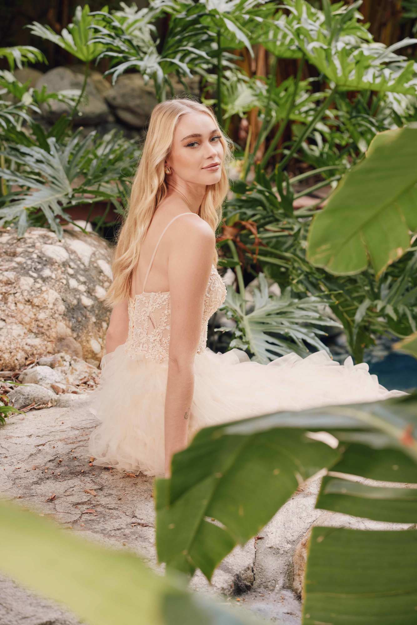 Ivory lace sleeveless tiered tulle A-line ruffled gown with delicate straps