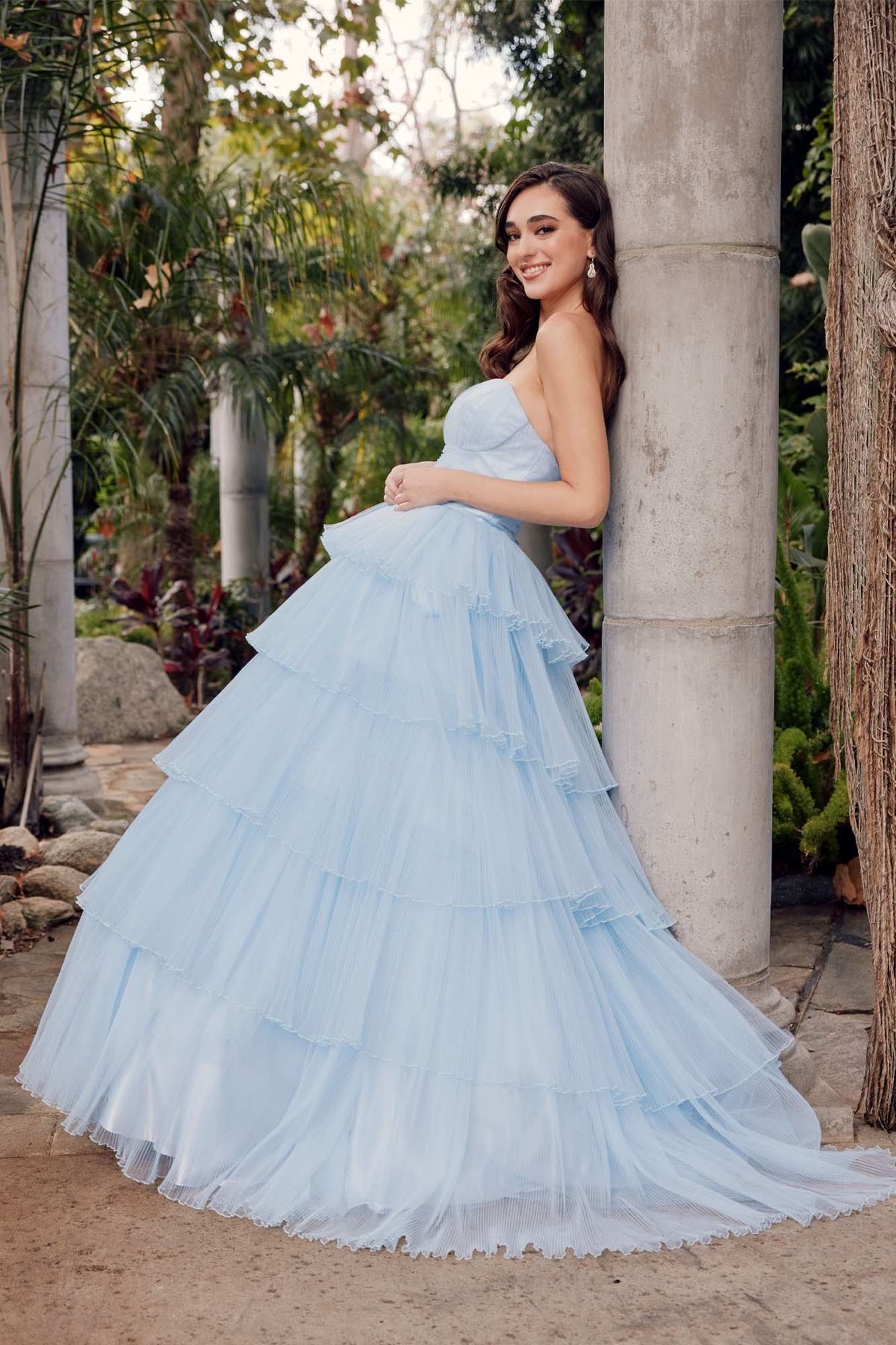 Ice blue strapless A-line tulle gown with tiered ruffle skirt and wide flared hem