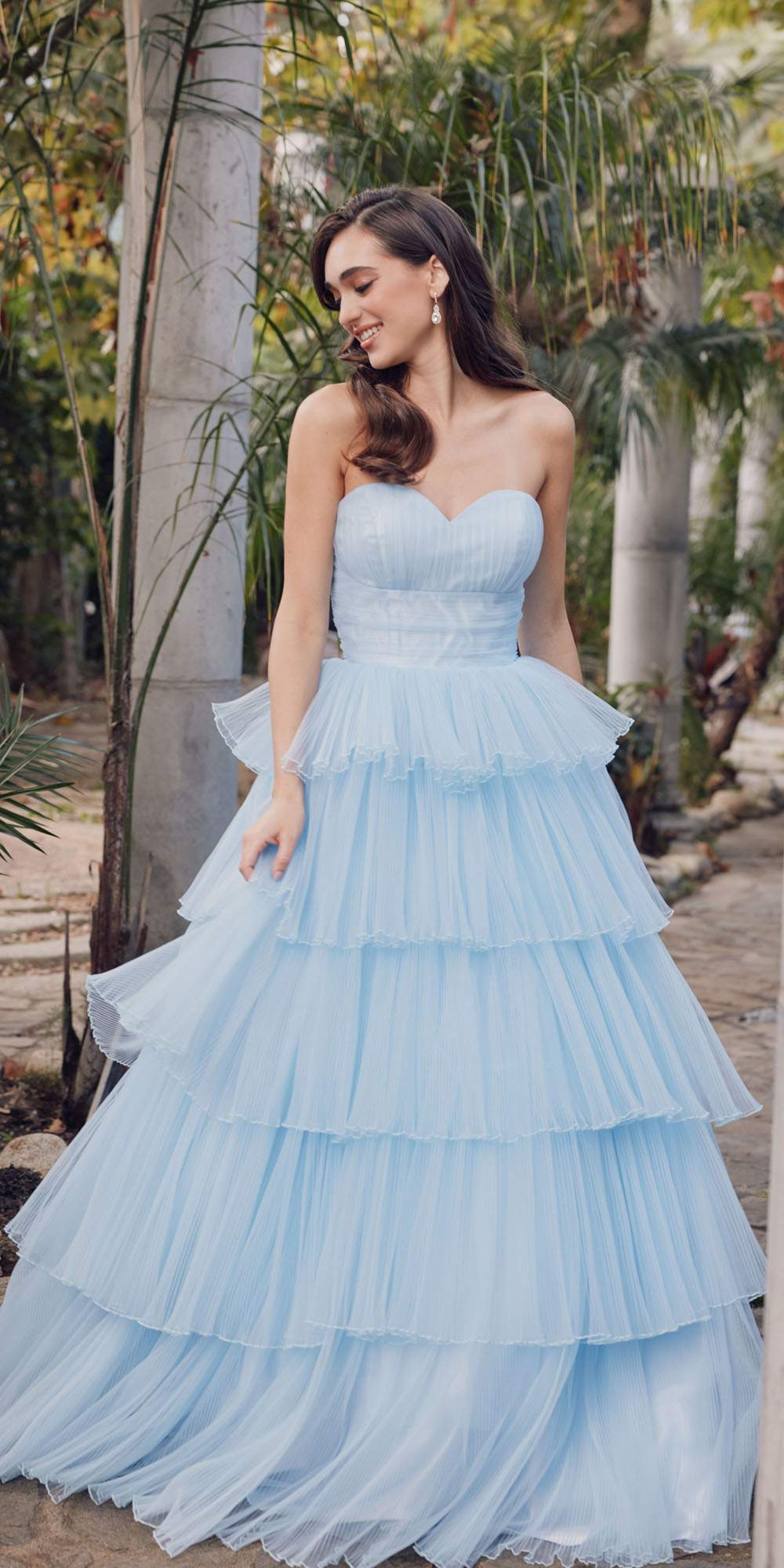 Ice blue strapless tulle A-line gown with tiered ruffle skirt and structured bust