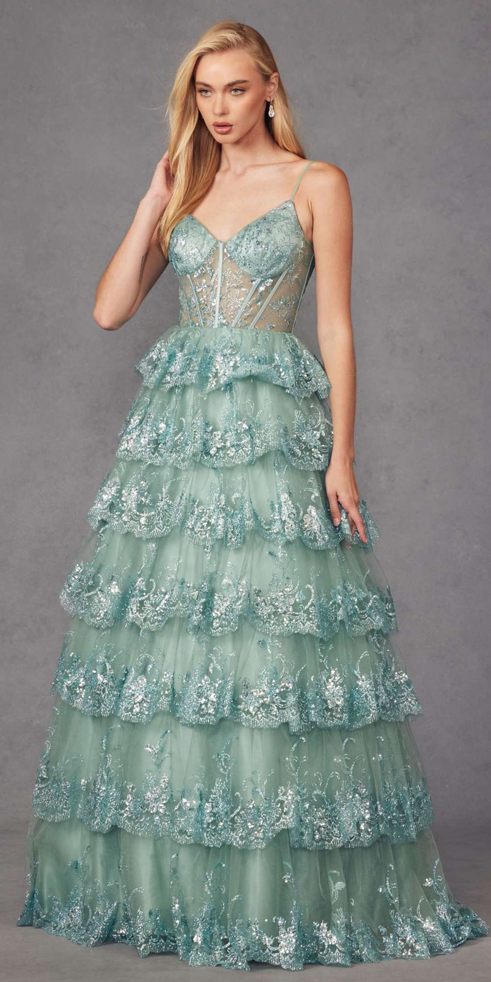 Sea green tiered sequin A-line gown with fitted bodice and cascading layered ruffles