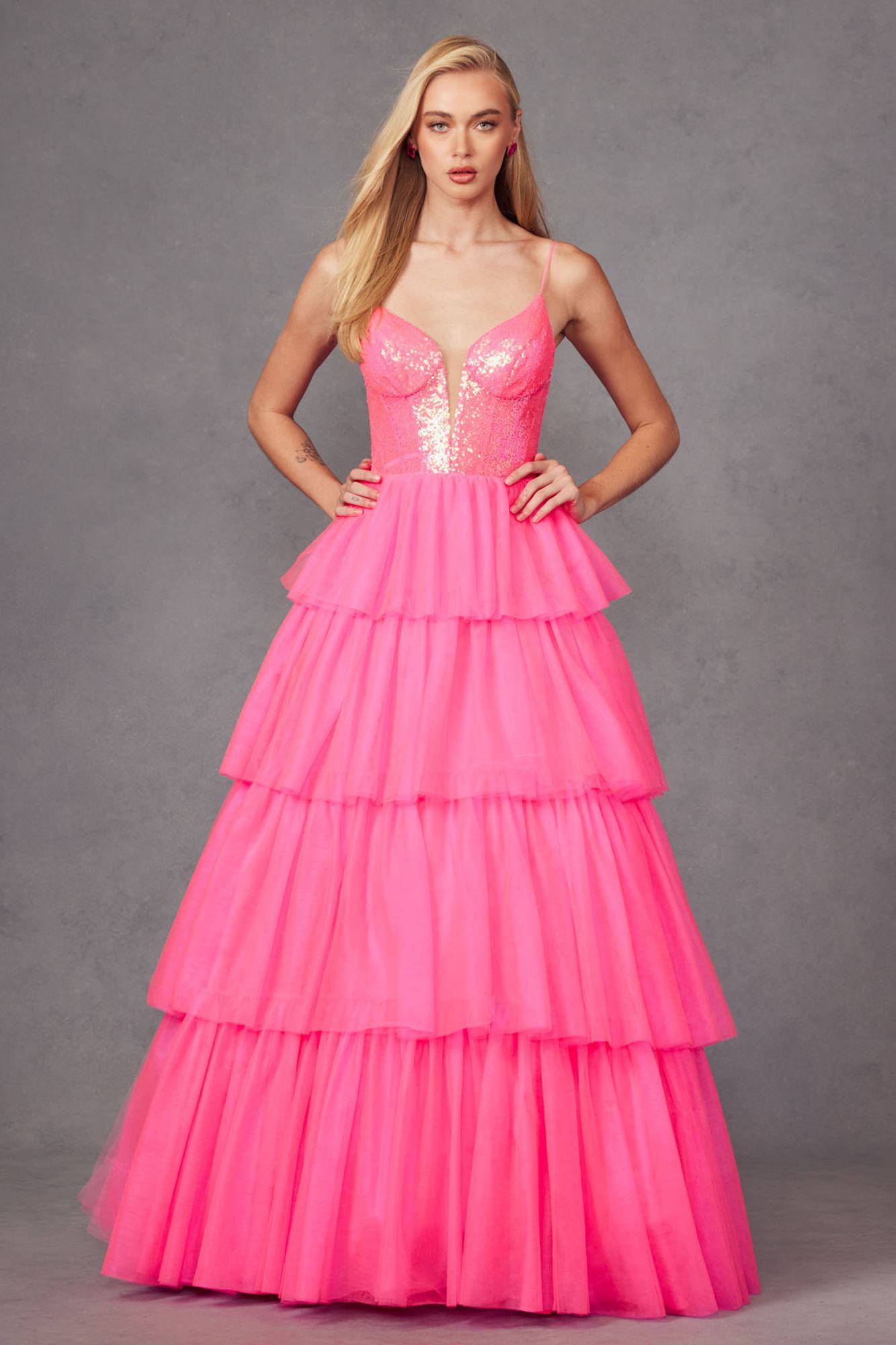 Bright fuchsia tiered ruffled tulle A-line dress with sequin bodice and layered skirt