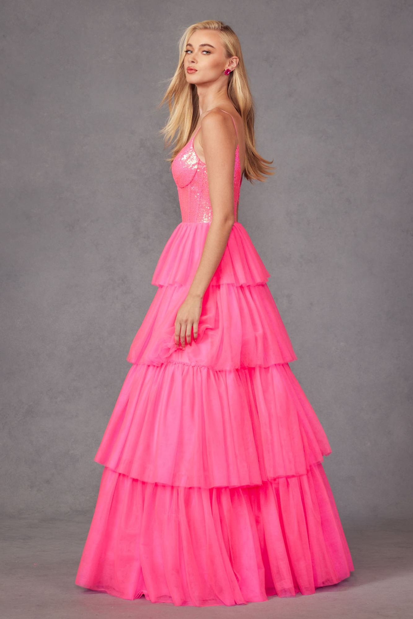 Bright fuchsia tiered ruffled tulle A-line dress with sparkling sequin bodice