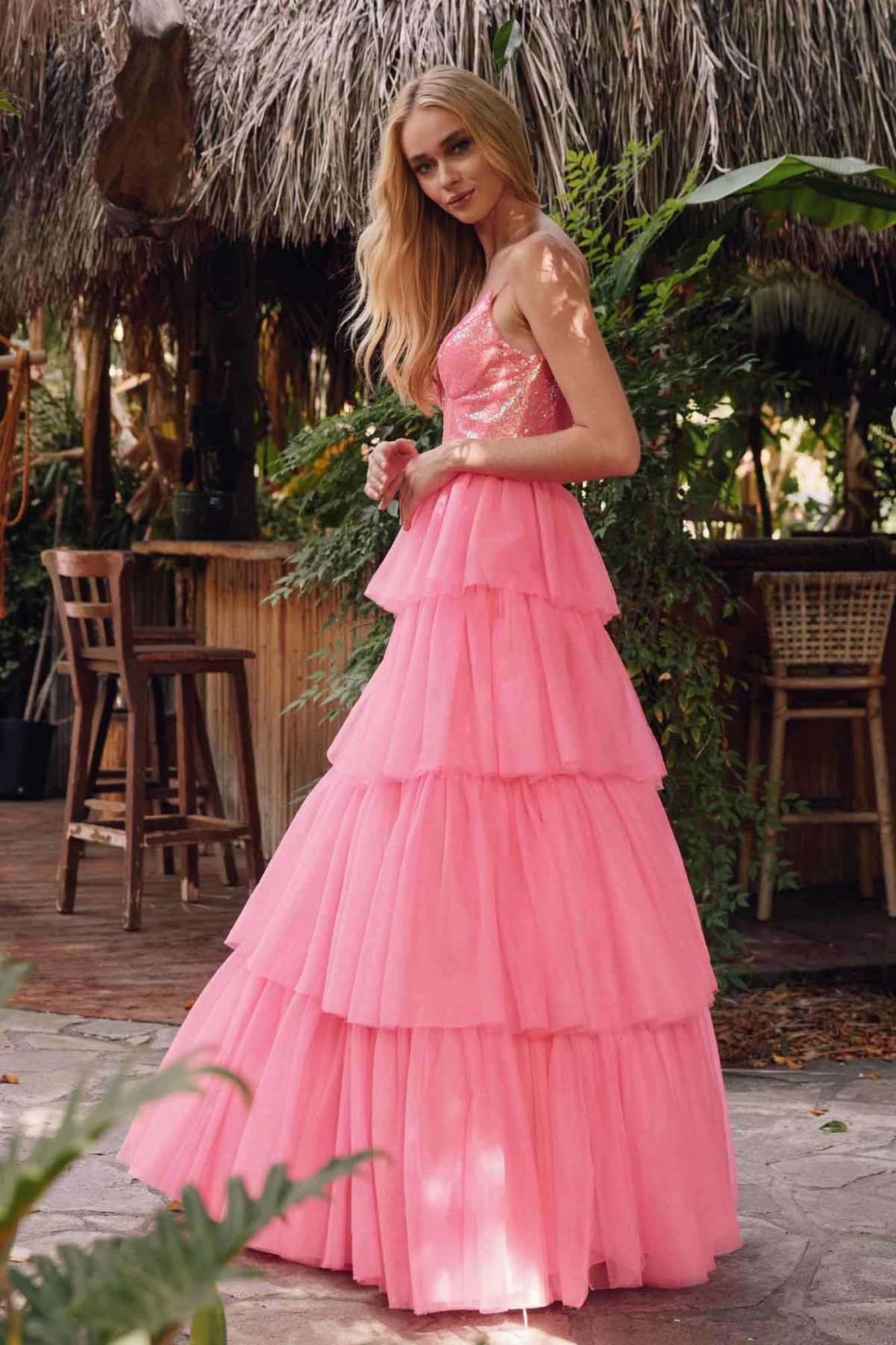 Bright fuchsia tiered ruffled tulle A-line dress with sequin bodice and flowing skirt