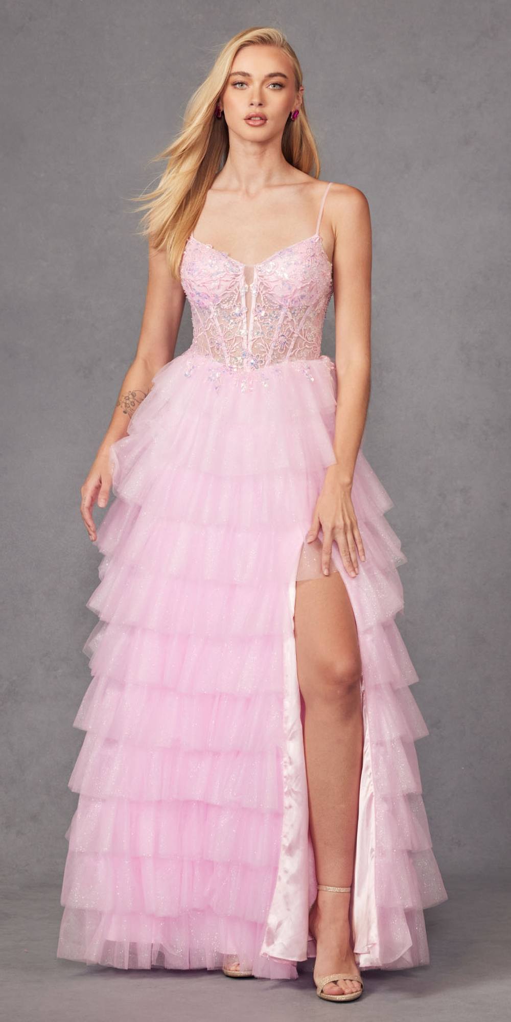 Baby pink long ruffle tulle ball gown with lace bustier bodice, thin straps, front slit