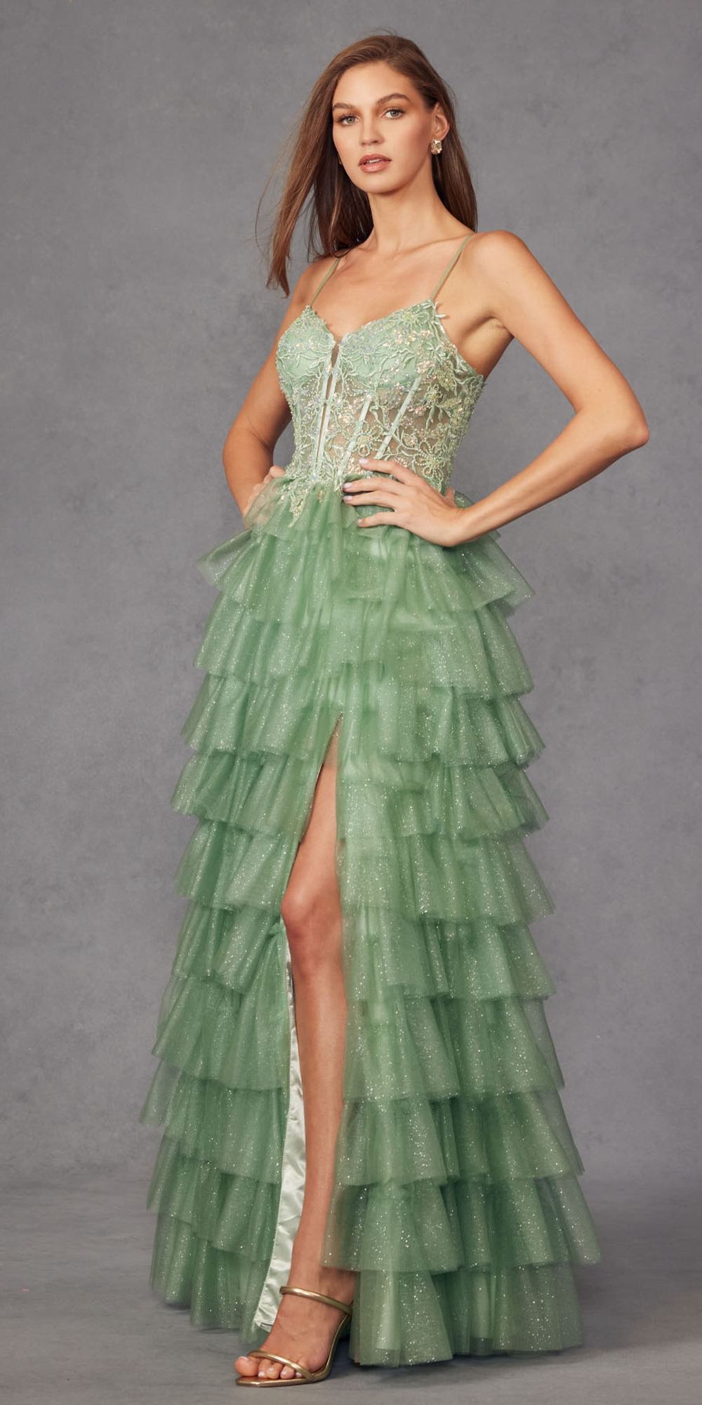 Sea green tiered tulle ball gown with bustier bodice, thin straps, front slit
