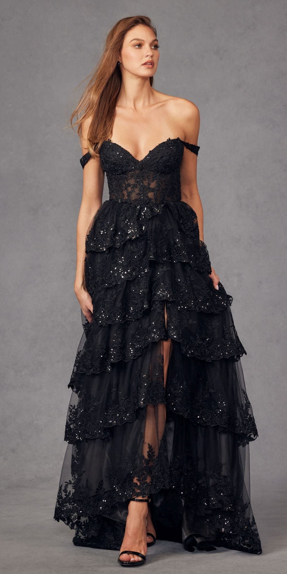 Black corset bodice A-line gown with layered ruffled skirt and sparkly speckle