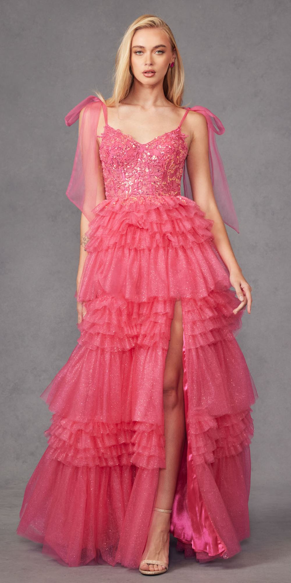 Fuchsia glitter tulle A-line gown with tiered ruffle skirt and sheer bow sleeves