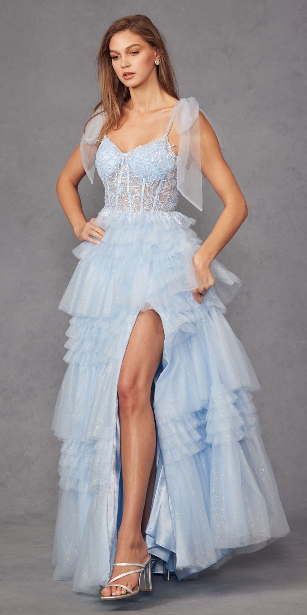 Ice blue glitter tulle A-line gown with thigh slit and layered ruffle skirt