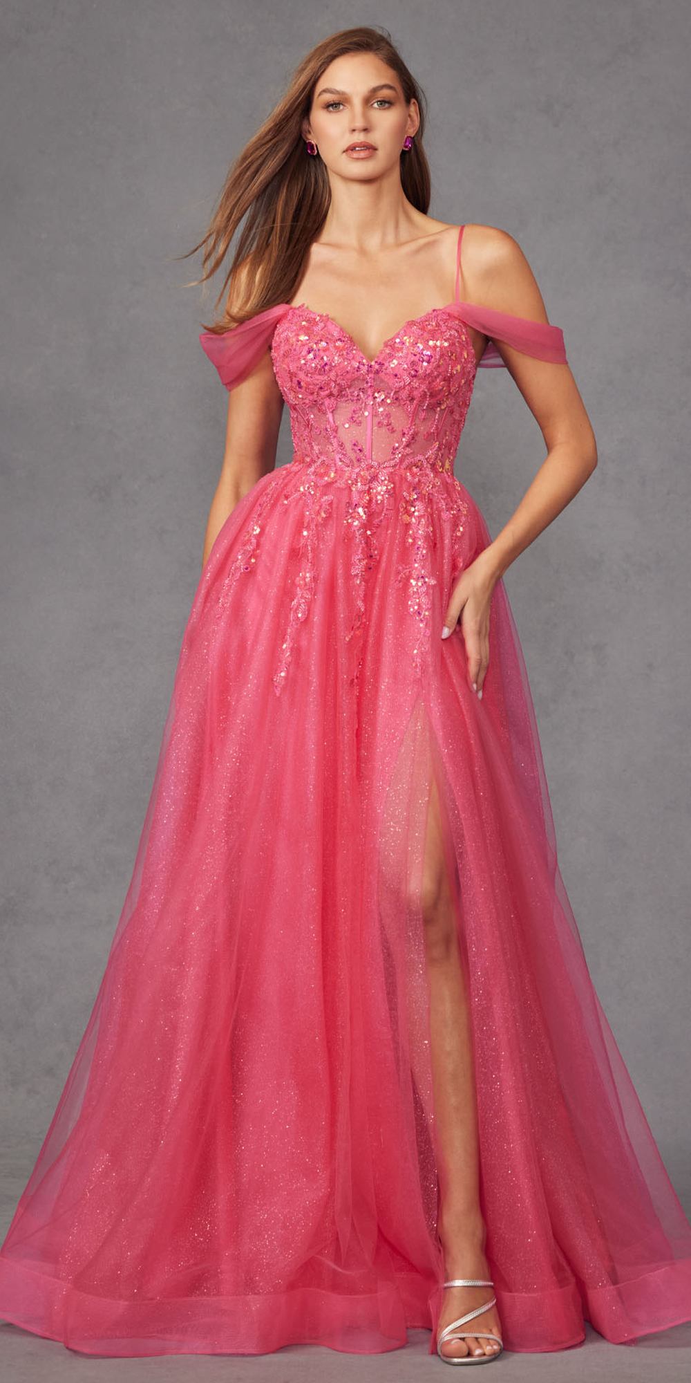 Pink cold-shoulder sweetheart corset gown with glitter bodice, flowing A-line skirt, thigh slit.