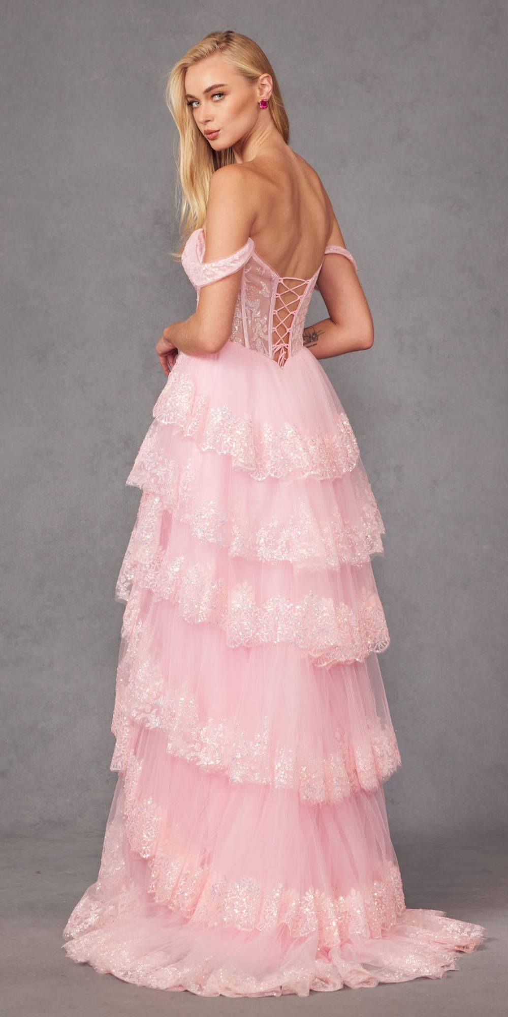 Ice pink off-shoulder A-line gown with lace corset, tiered ruffles, and back cutout