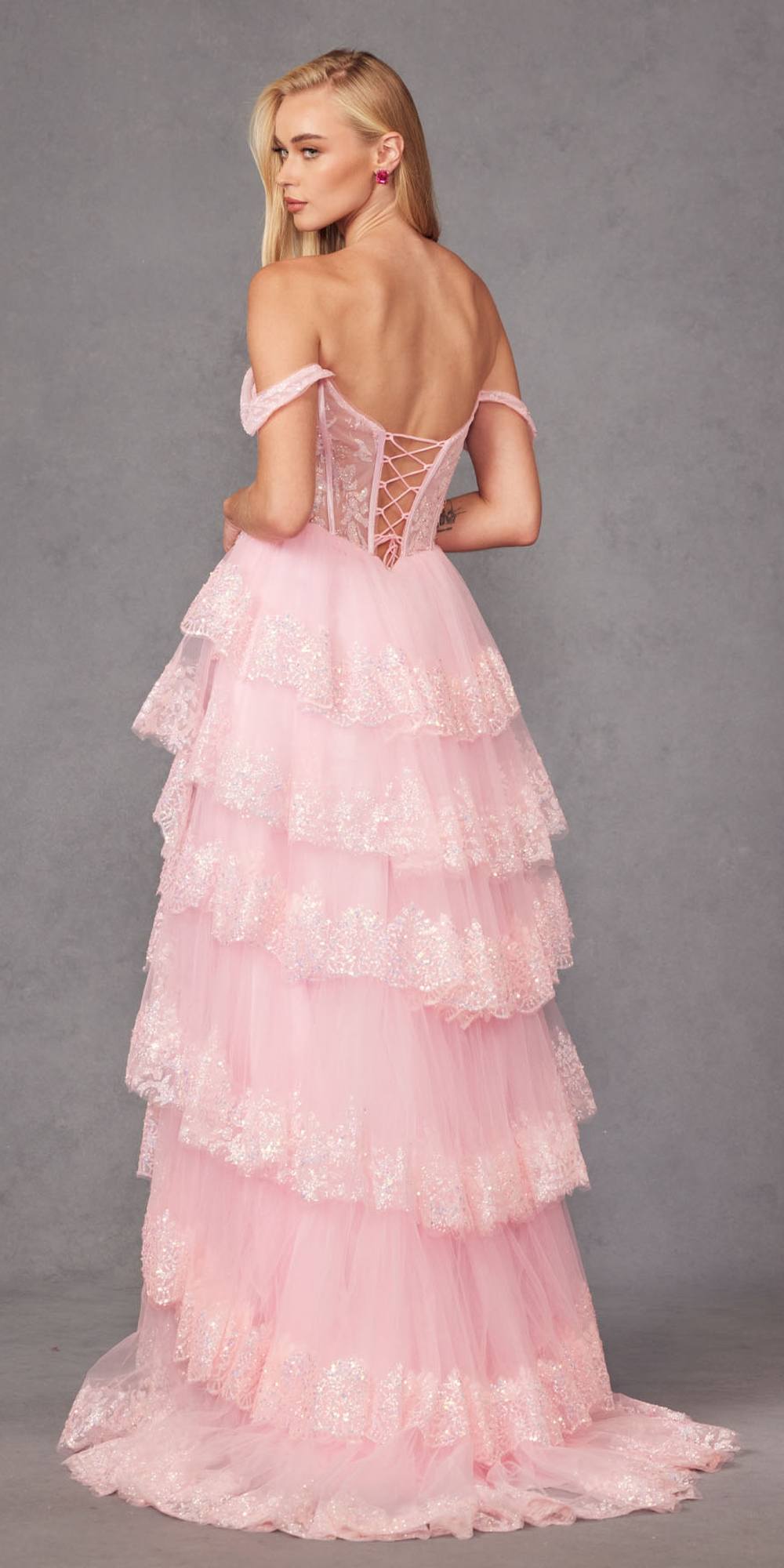 Ice pink off-shoulder A-line gown with lace corset, tiered ruffles, and open back