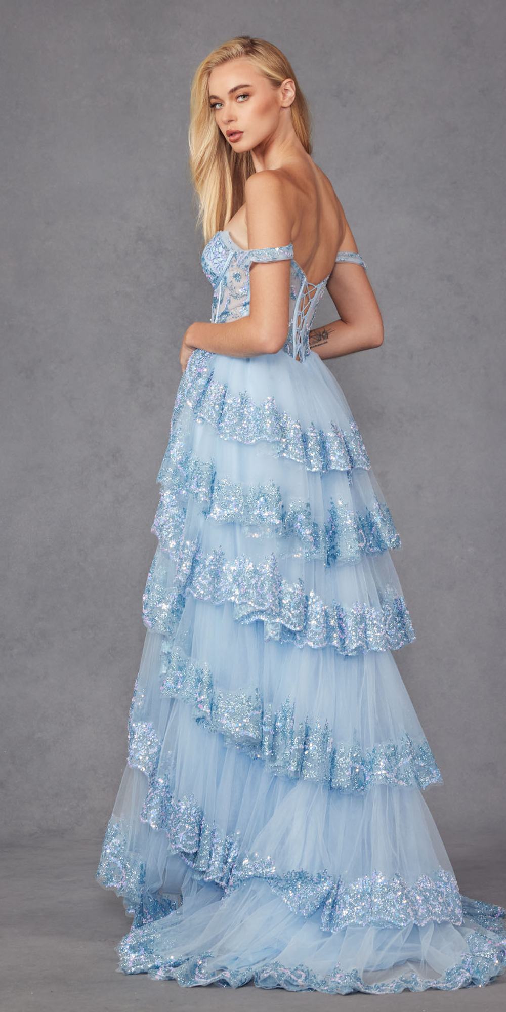Light blue off-shoulder A-line gown with tiered ruffles and sheer layered skirt hem