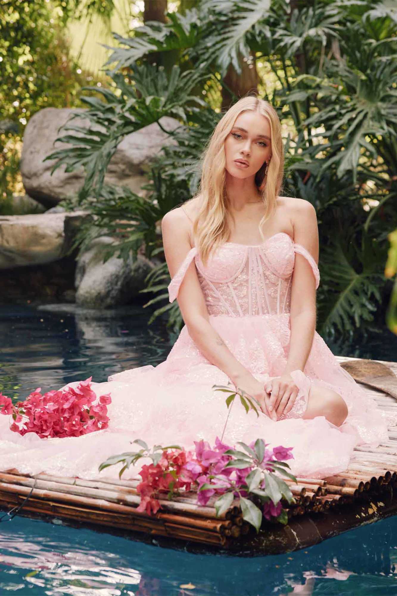 Ice pink off-shoulder gown with corset bodice and flowing tiered ruffle skirt