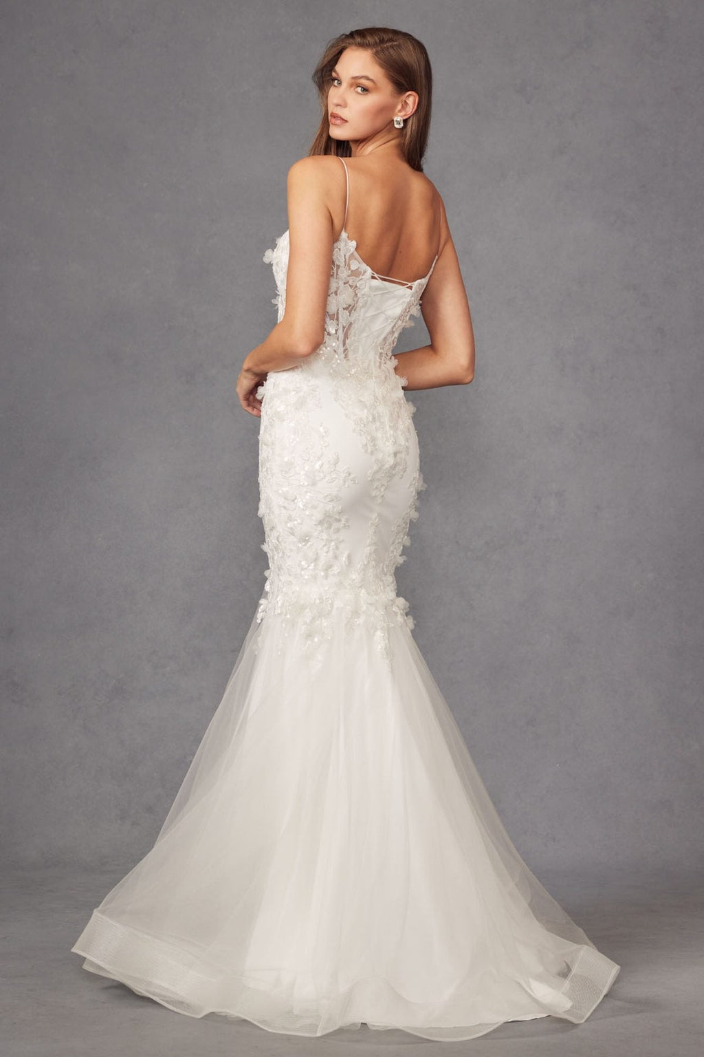 White sweetheart lace gown with spaghetti straps, fitted body, and flared tulle skirt