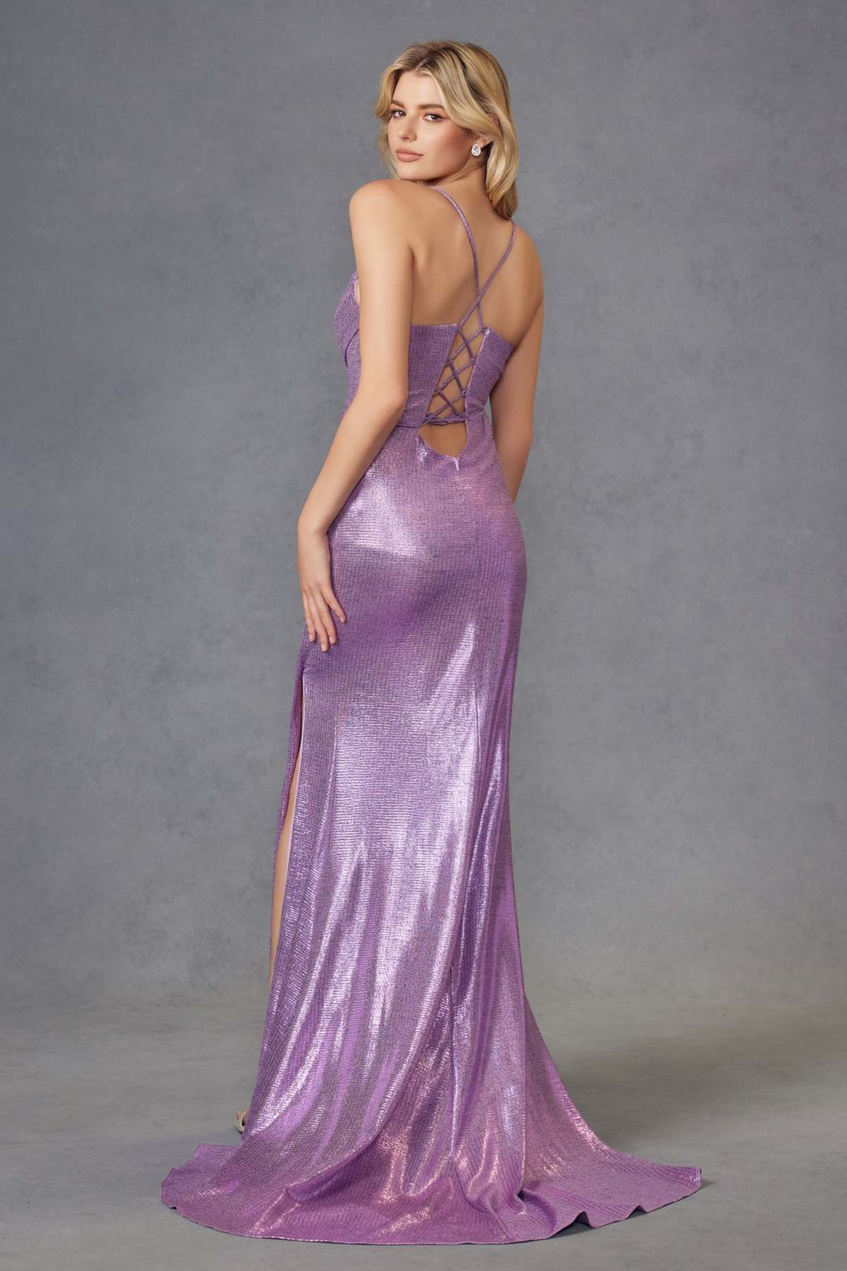 Metallic lilac gown with crisscross back straps, ruched bodice, and side slit