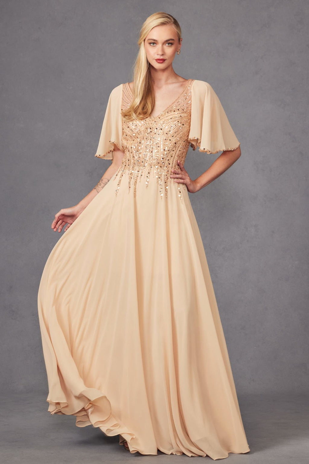 Champagne long A-line evening gown with V-neck, flutter sleeves, and beaded bodice