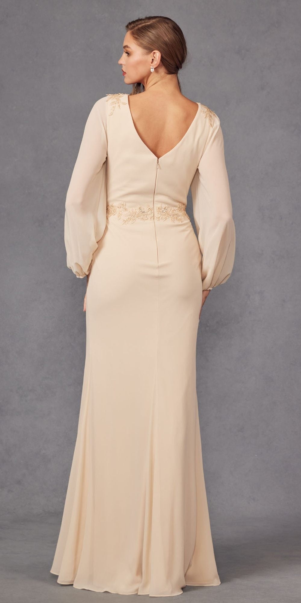 Champagne long-sleeve evening gown with open back and embroidered seam at waist