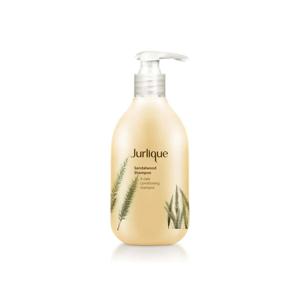 JURLIQUE sandalwood shampoo bottle with pump, amber lotion-like liquid, beige label