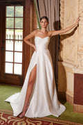 White strapless A-line gown with sweetheart neckline, high slit and sweep train