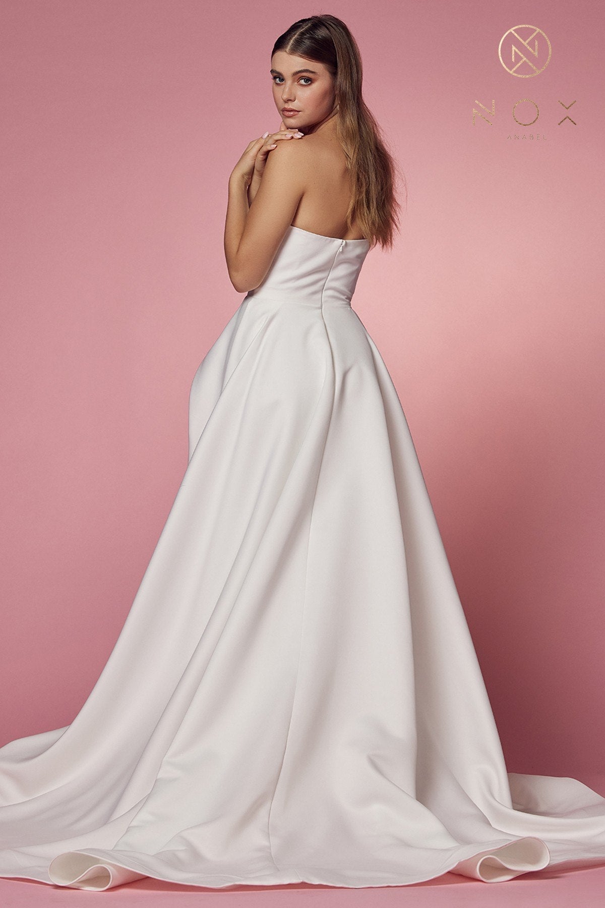 White strapless A-line gown with sweetheart neckline, high slit and long sweep train