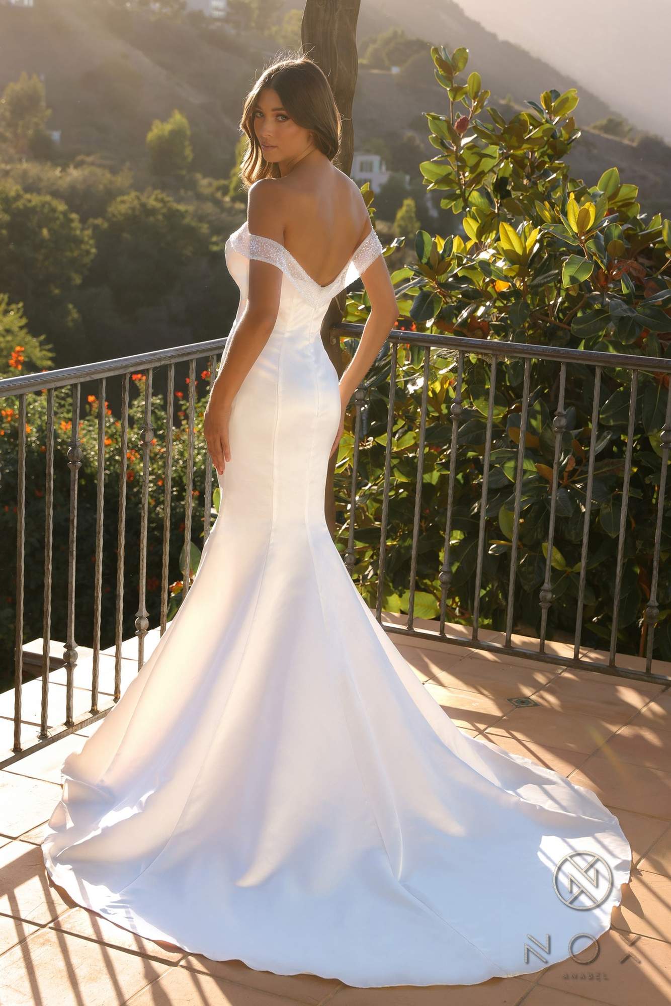 White off-shoulder sweetheart mermaid wedding dress, fitted bodice with flowing flare