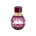 Fever eau de parfum glass bottle with purple embossed pattern and gold cap
