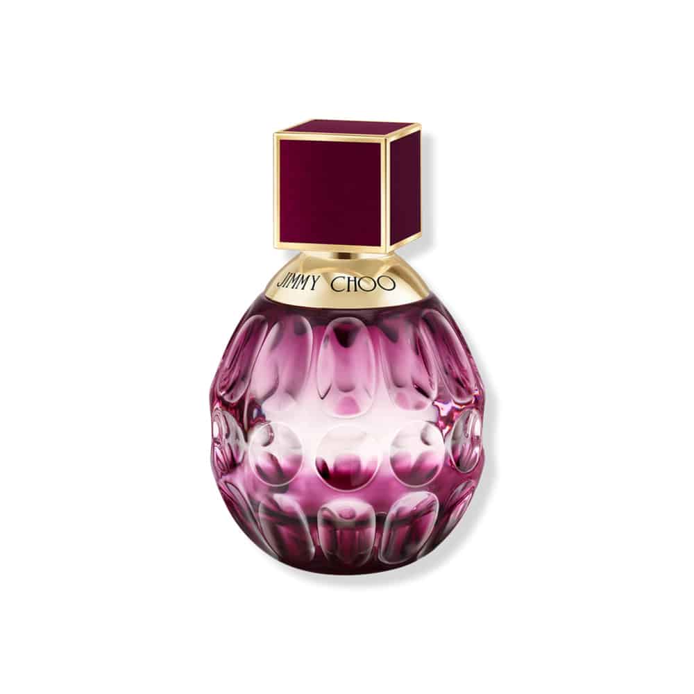 Fever eau de parfum glass bottle with purple embossed pattern and gold cap