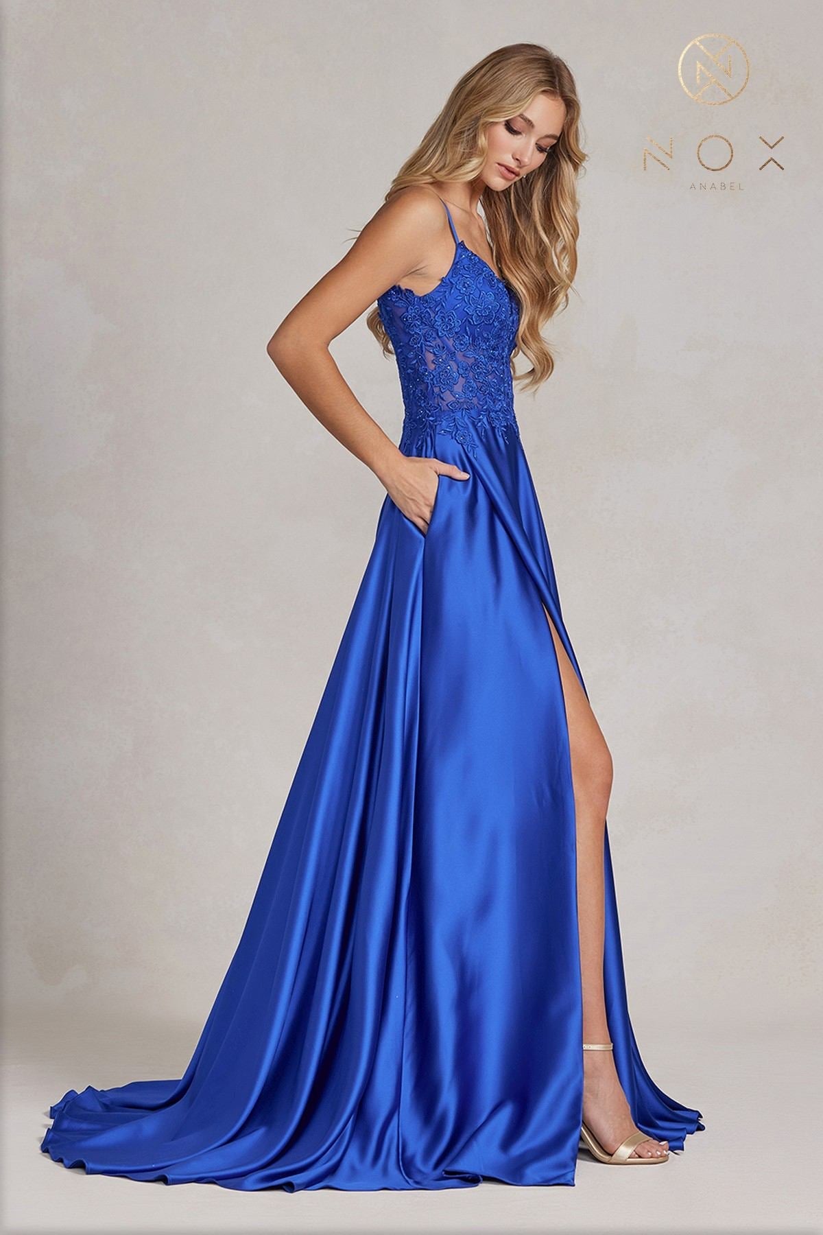 Royal blue A-line formal gown with lace bodice, spaghetti straps, side slit