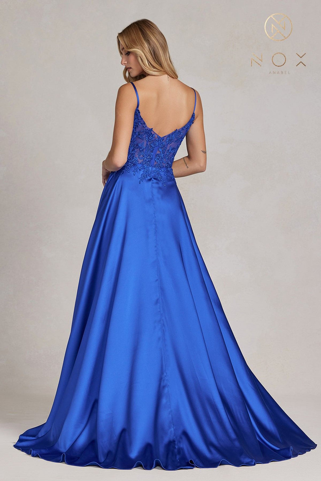 Royal blue A-line formal gown with lace back, spaghetti straps, flowing skirt