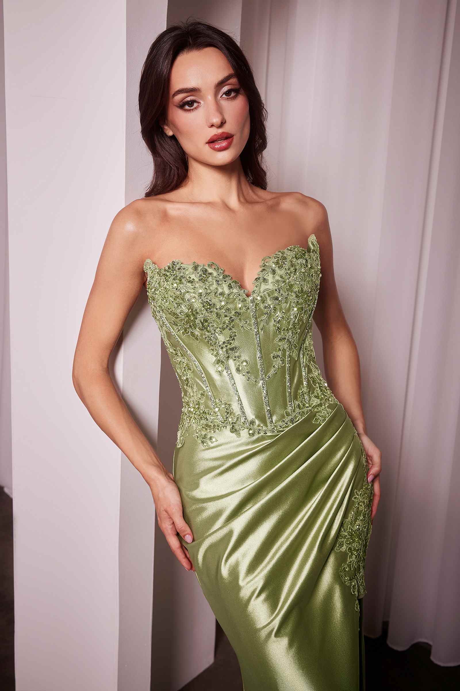 Light green strapless lace bodice and satin gown with sweetheart neckline and front slit.