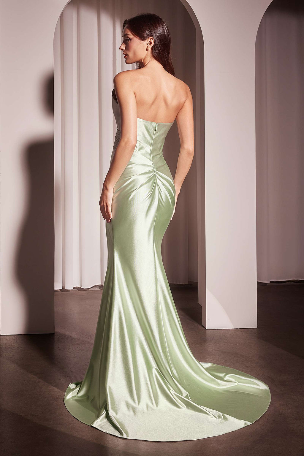 Strapless satin gown in sage green with fitted silhouette and open-back detail