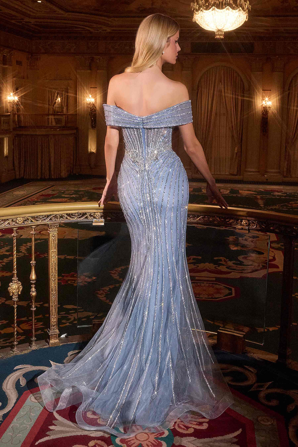 Blue off-shoulder mermaid gown with crystal beading and sheer tulle skirt, back view