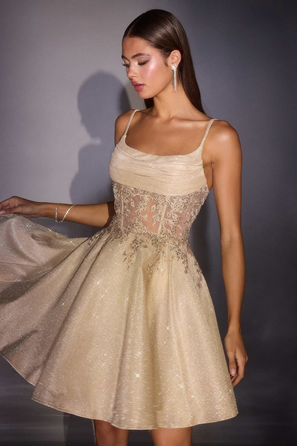 Champagne glitter homecoming dress with spaghetti straps and lace-like bodice detail
