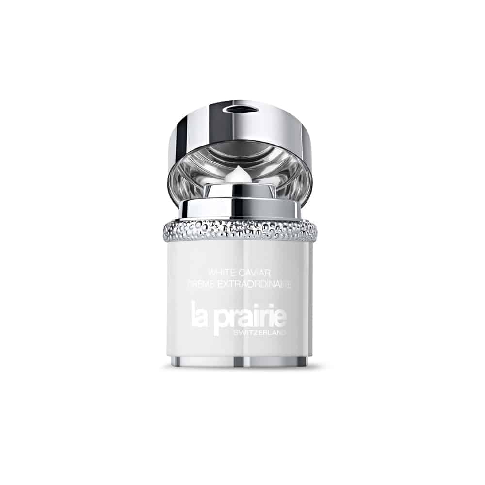 White skincare cream jar with silver cap and pump