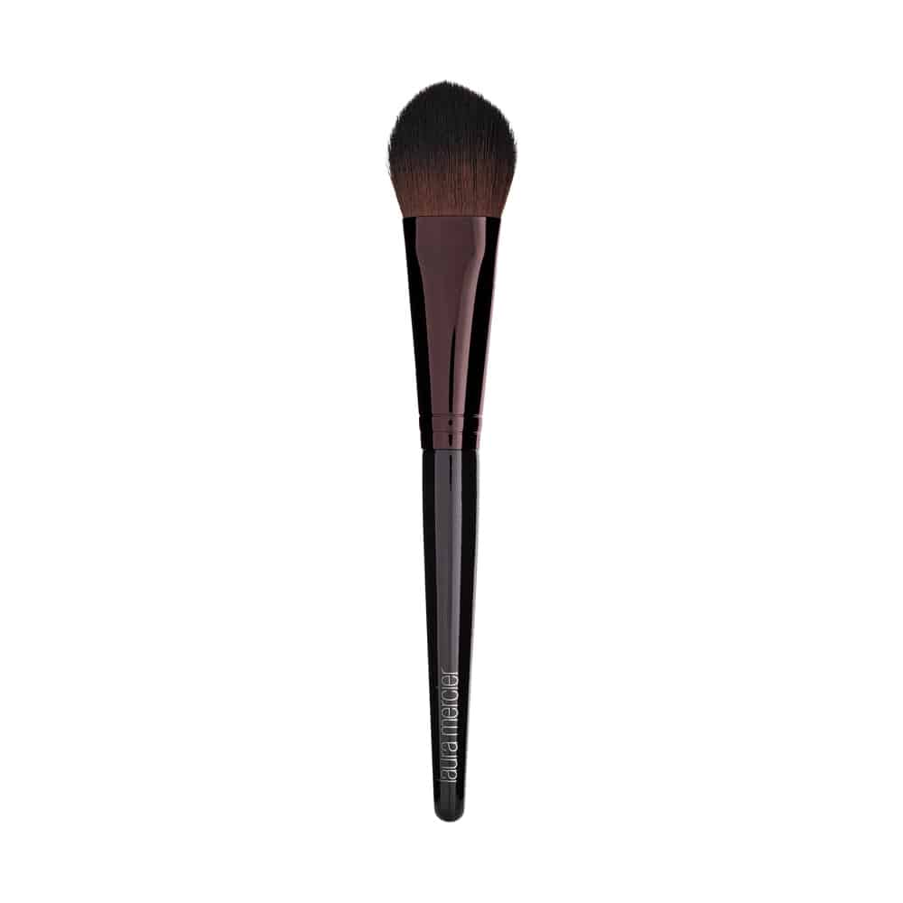 Cheek color brush with soft dark bristles and dark purple ferrule