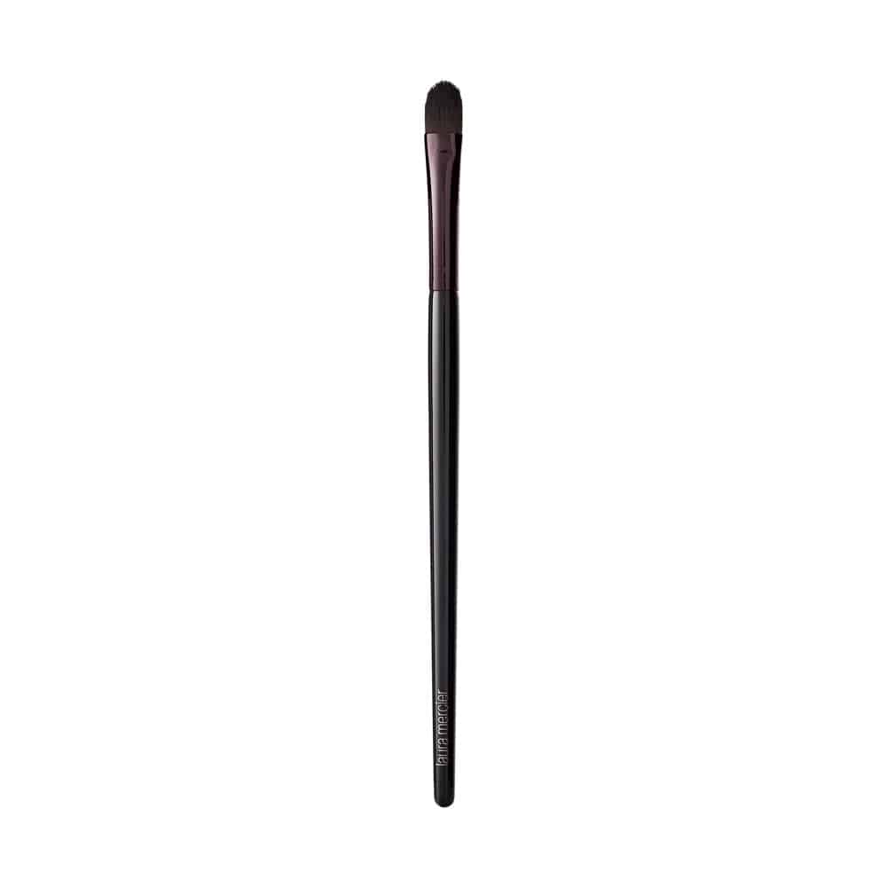 Eye color brush with slim black handle and burgundy ferrule, tapered bristle tip.