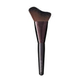 Glow powder brush with tapered brown bristles and dark handle