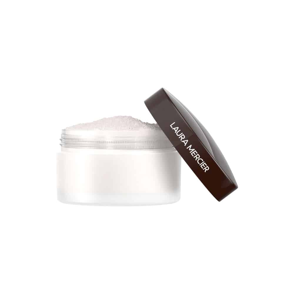 Brightening under-eye powder jar with white powder and brown applicator cap