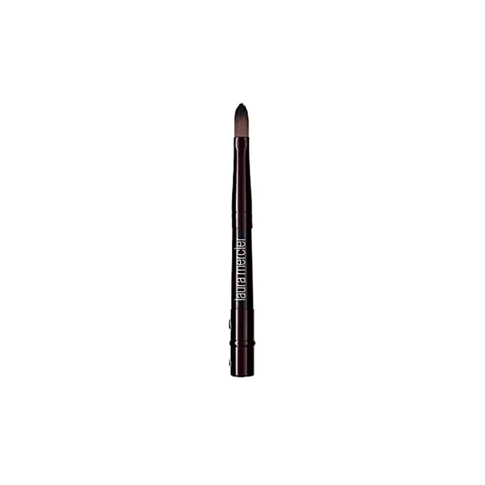 Laura Mercier concealer brush with dark handle and tapered soft bristles
