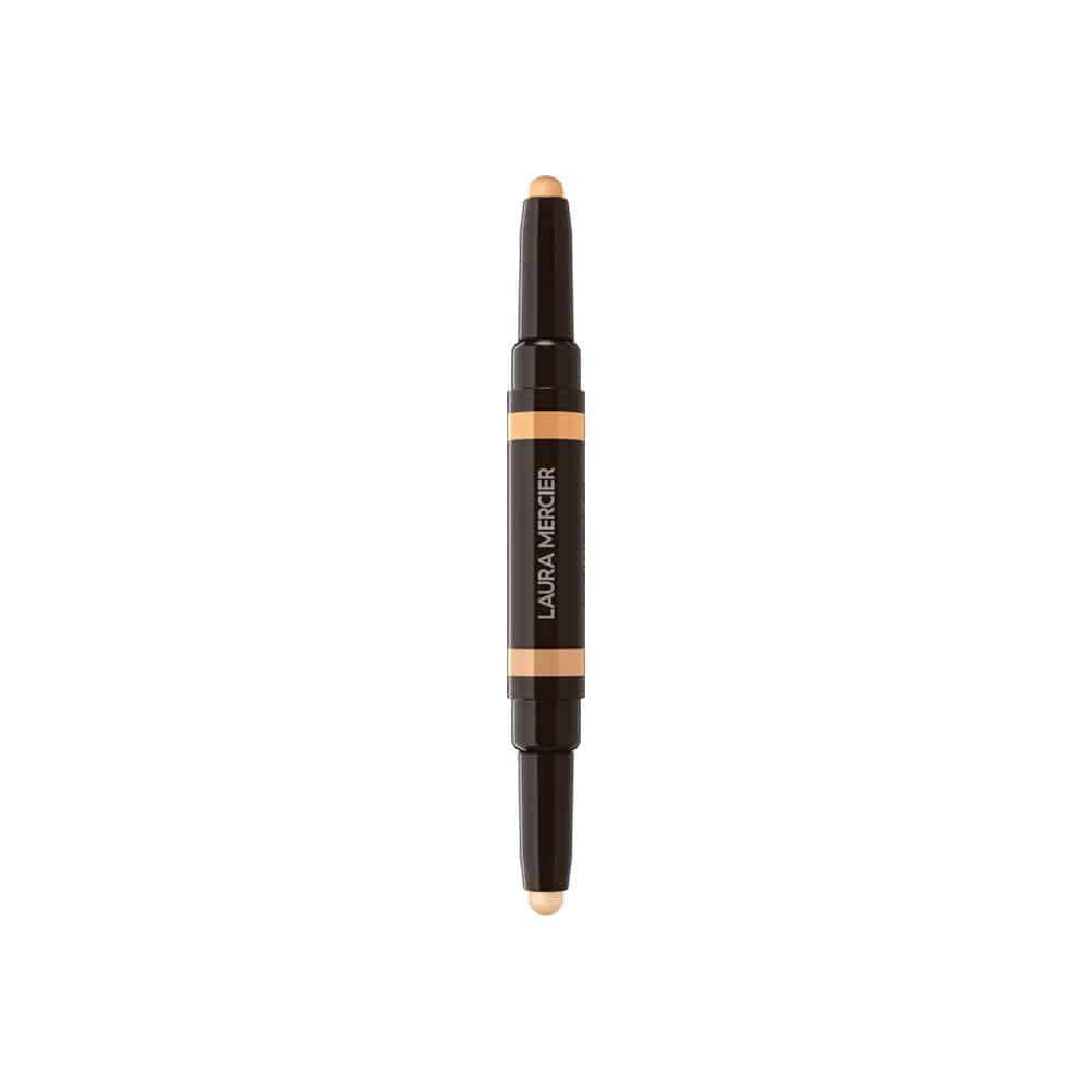 Concealer stick featuring a beige tip, dark casing, and orange label band
